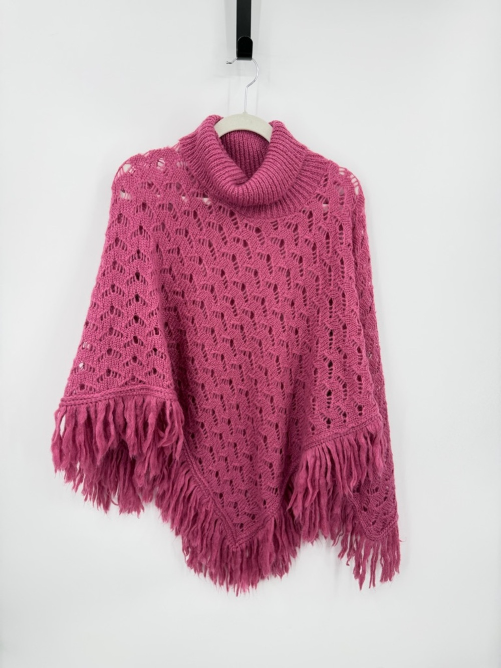 On tek pink poncho with a turtle neck and fringed hem crochet mohair blend O/S